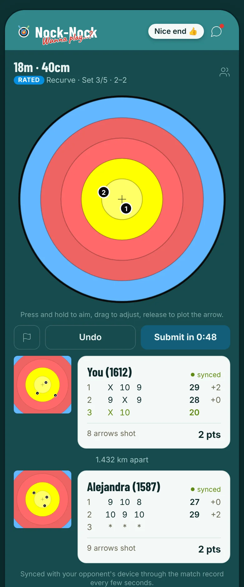The match screen with the target face, buttons and both scorecards